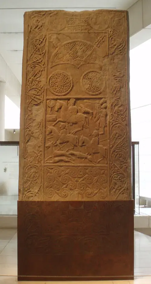 Carved battle scene on a Pictish stone showing mounted and foot warriors in combat