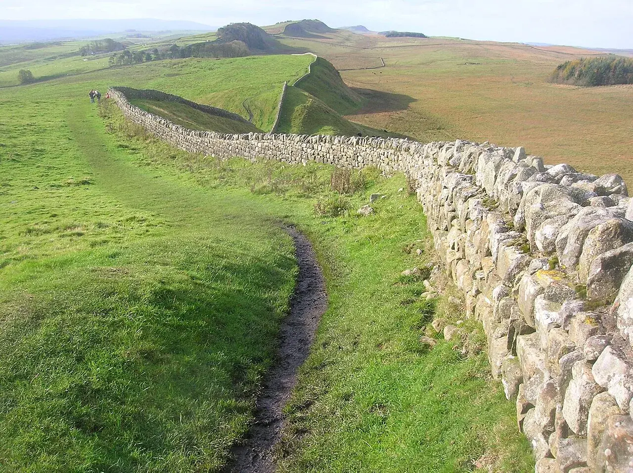 A long stretch of Hadrian's Wall running across the hills of northern England