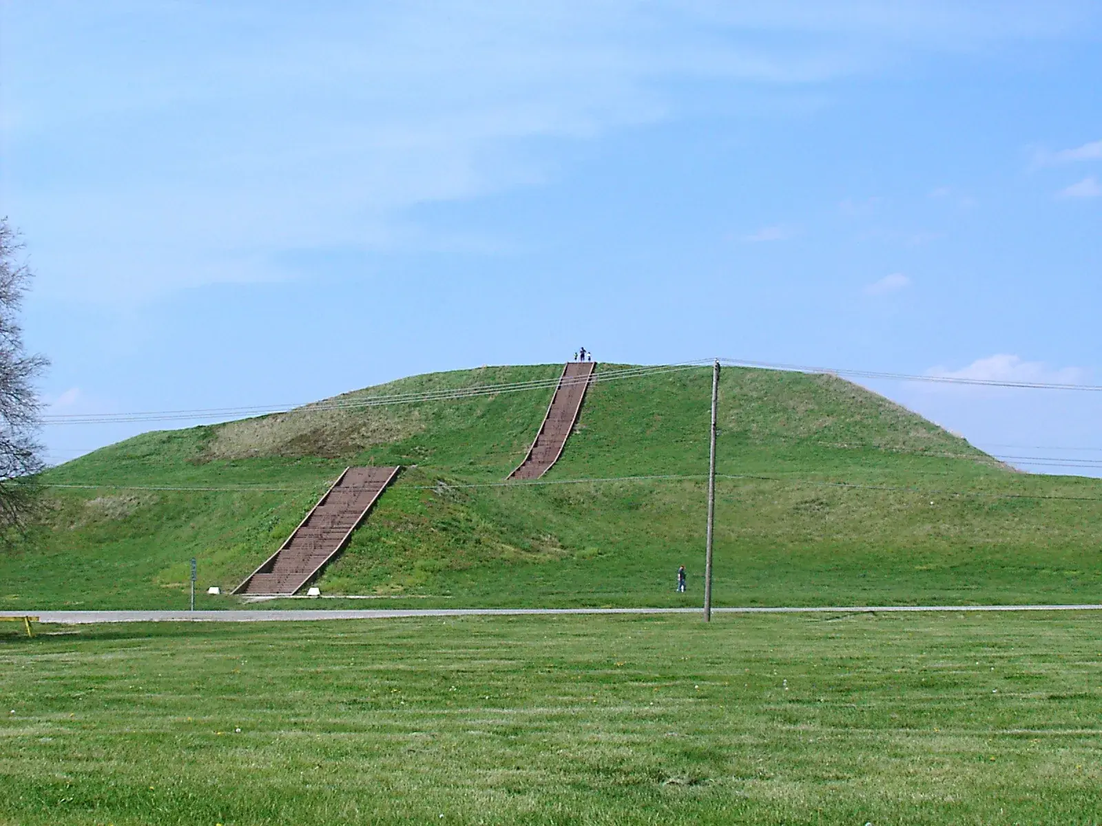 Monks Mound at Cahokia, a massive earthen platform mound rising above the surrounding grassland
