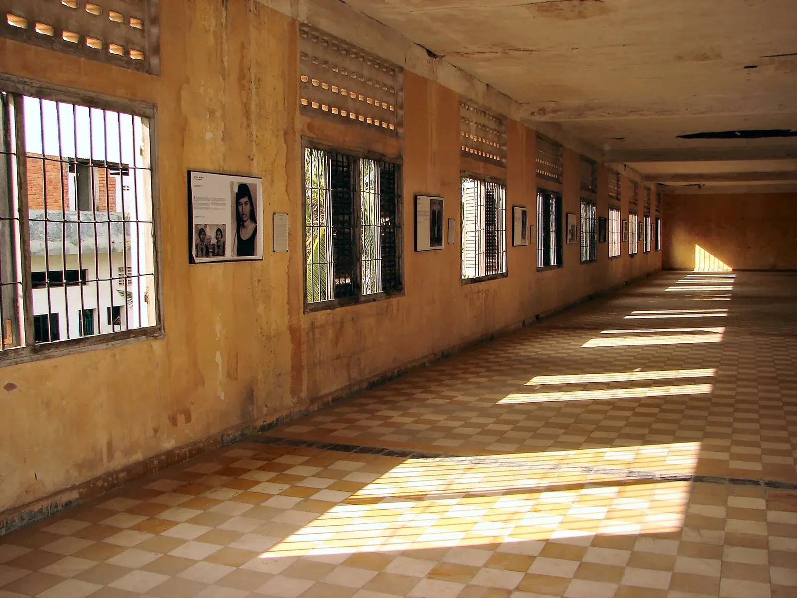 Rows of cells and photographs of victims inside the former Tuol Sleng (S-21) prison in Phnom Penh