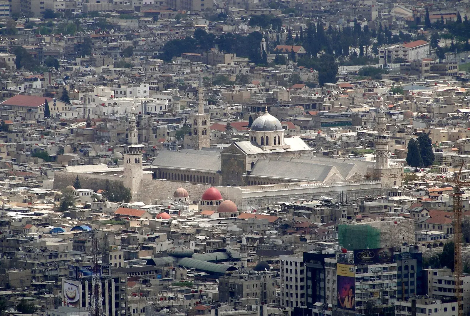 The courtyard and mosaic-covered facade of the Great Mosque of Damascus, built under the Umayyads